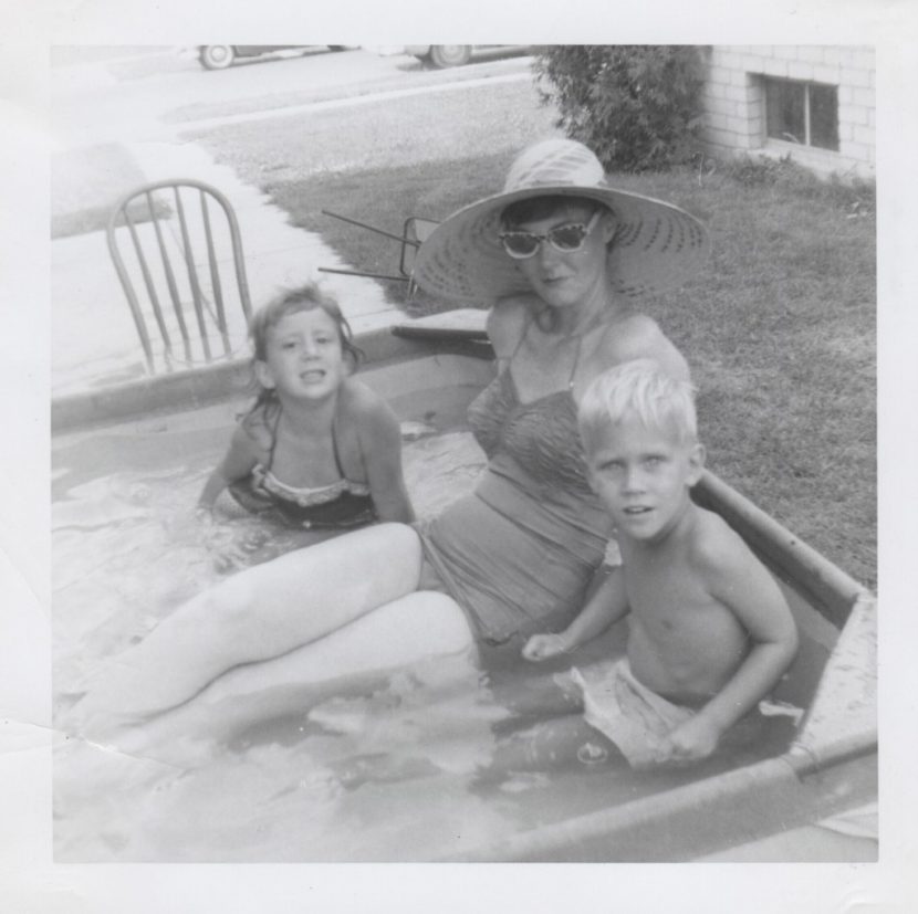 Mom and Tommy, her baby brother, and me in a kiddy pool in our side yard in Detroit, Michigan 1954.