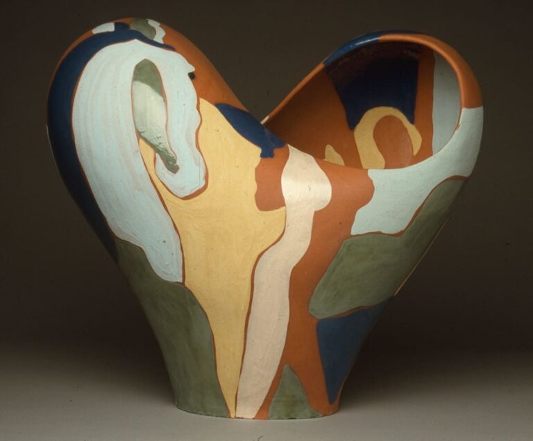 Ceramic heart form cut by infinity symbol with colored slip surface
