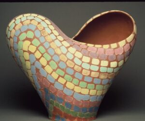 Ceramic heart form cut by infinity symbol with colored slip surface