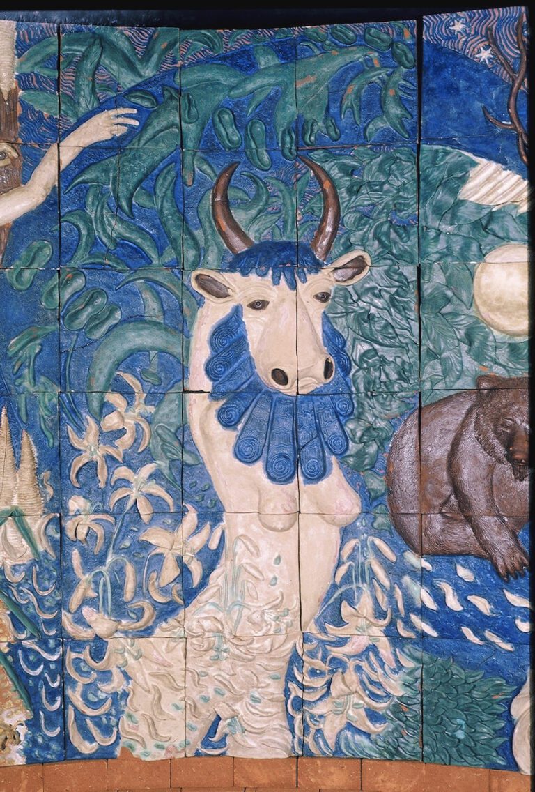 High relief ceramic tile wall depicting the mythological goddess Hera with a bull's head
