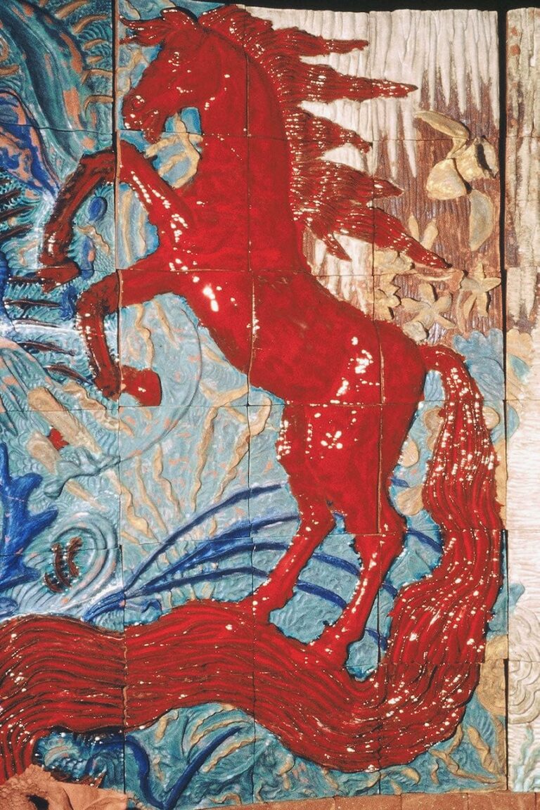 High relief ceramic tile wall of rearing red horse